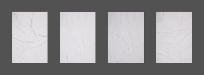 Collection of creased blank posters on grey background. Banner design