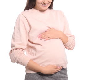 Young pregnant woman in casual clothes on white background