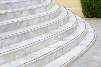 Photo of Tiled stairs outdoors, closeup view. Entrance design