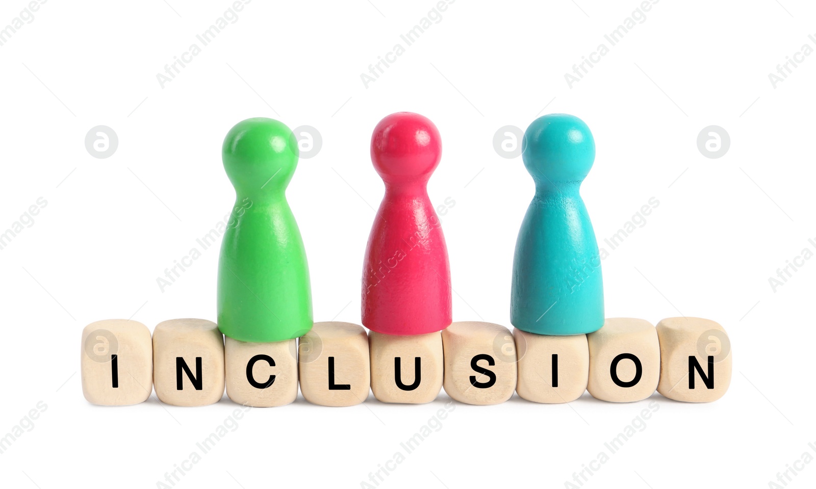 Photo of Colorful pawns and wooden cubes with word Inclusion on white background