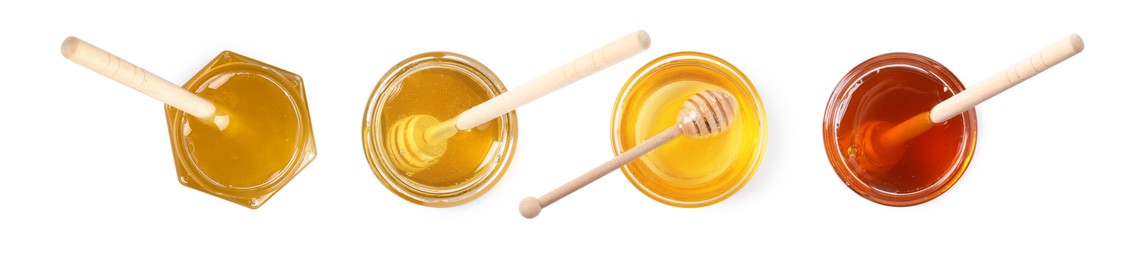 Image of Natural honey in glass jars and dippers isolated on white, top view