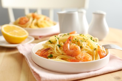 Delicious pasta with shrimps on plate