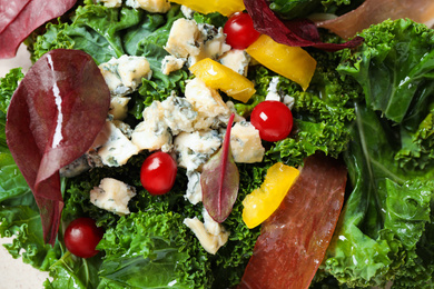 Photo of Tasty fresh kale salad as background, closeup