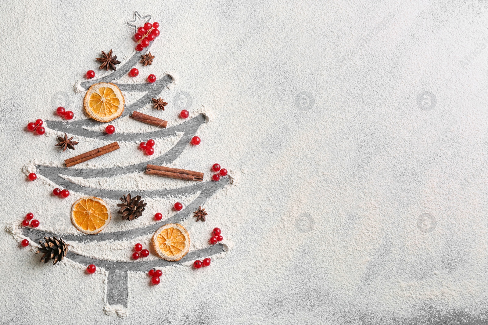 Photo of Flat lay composition with Christmas tree made of flour on grey table, flat lay. Space for text