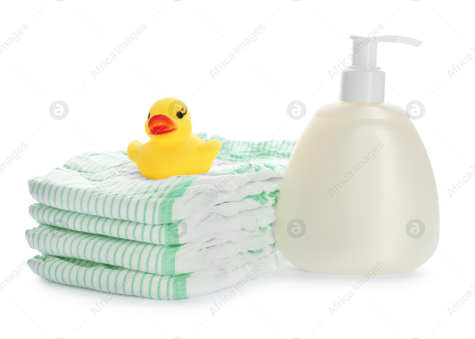 Photo of Stack of disposable diapers and baby accessories on white background