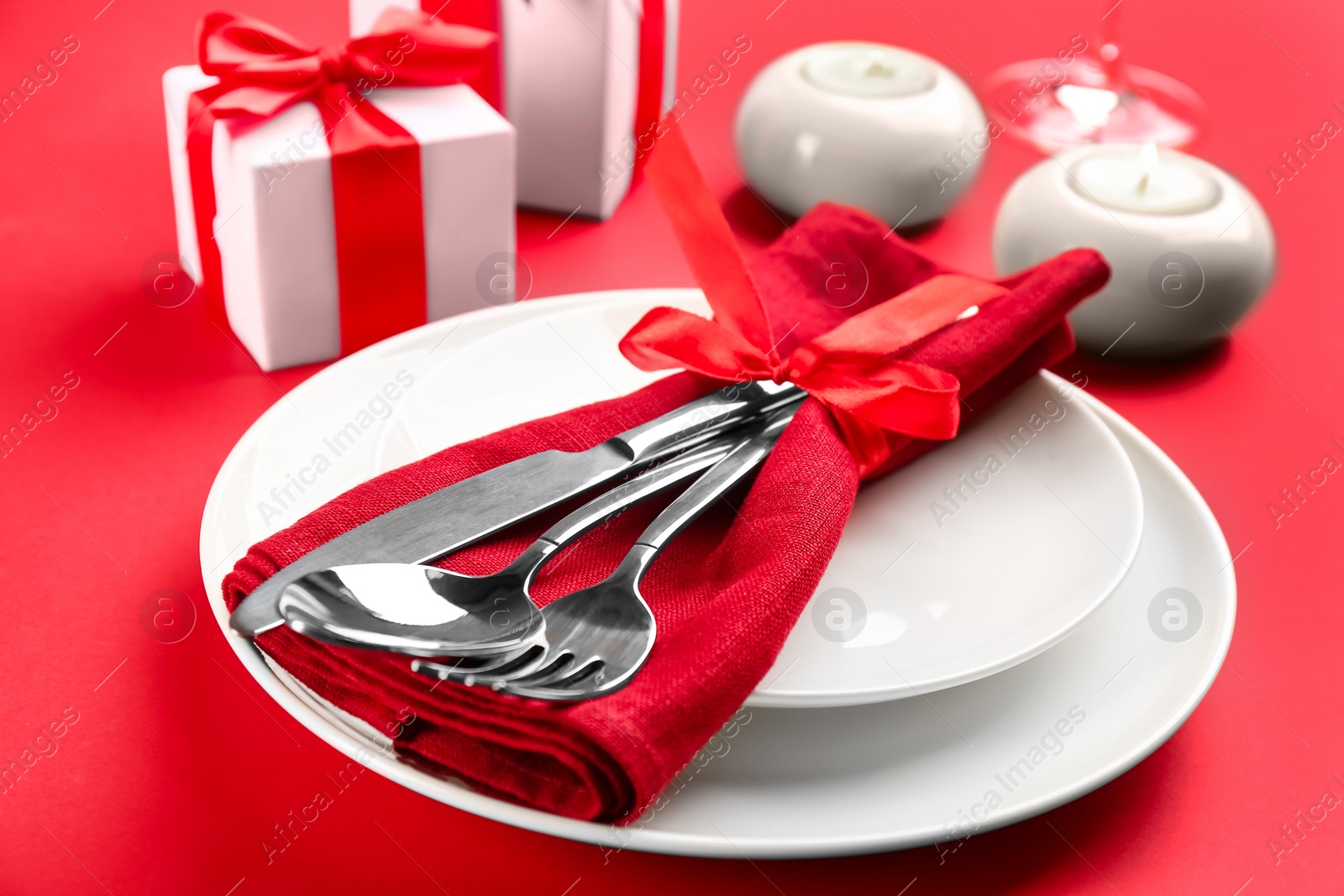 Photo of Beautiful table setting for Valentine's Day on red background