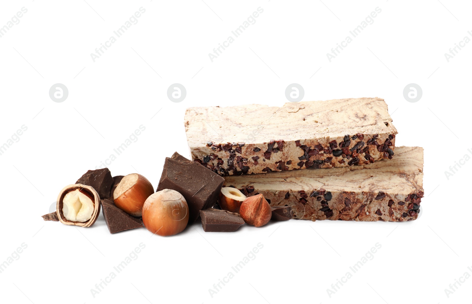 Image of Tasty halva, pieces of chocolate and hazelnuts isolated on white