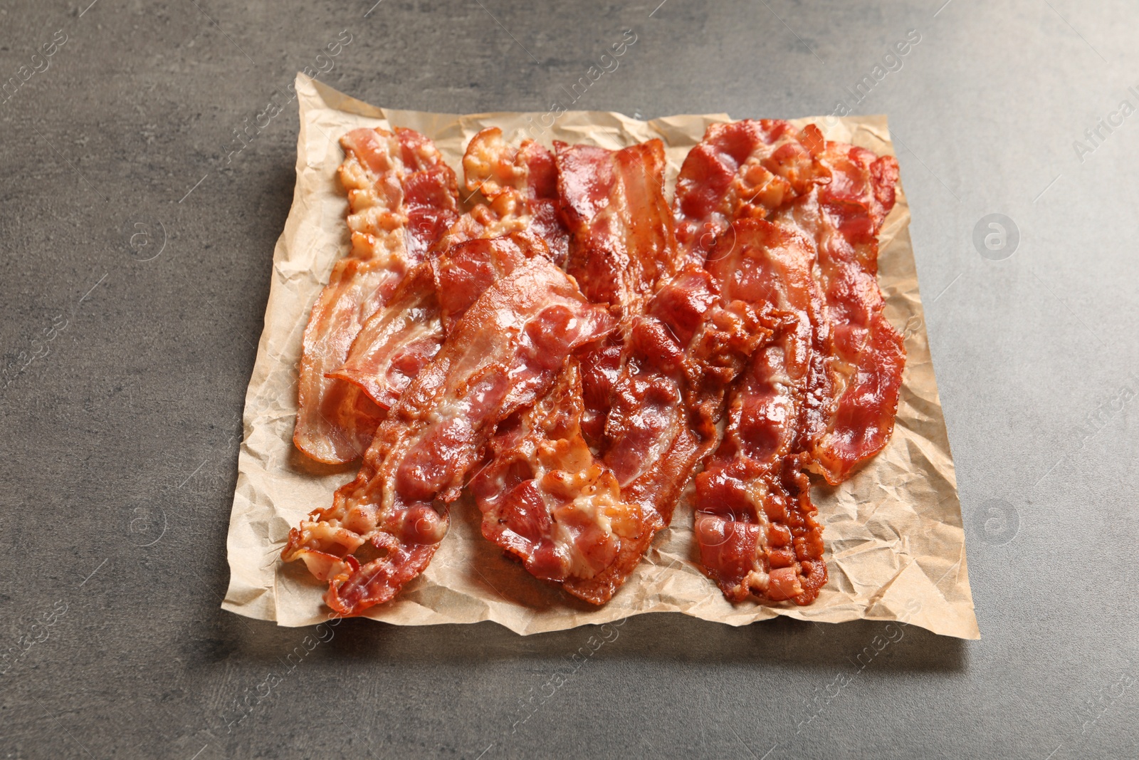 Photo of Fried bacon on grey background