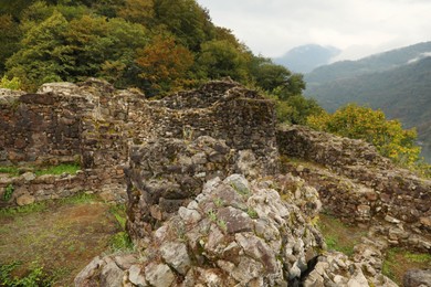 Photo of View on stone ruins and forest in mountains