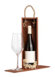Photo of Wooden gift box with wine and glass isolated on white