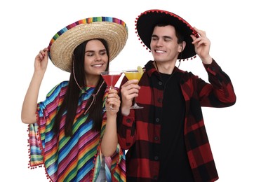 Photo of Lovely couple in Mexican sombrero hats with cocktails on white background