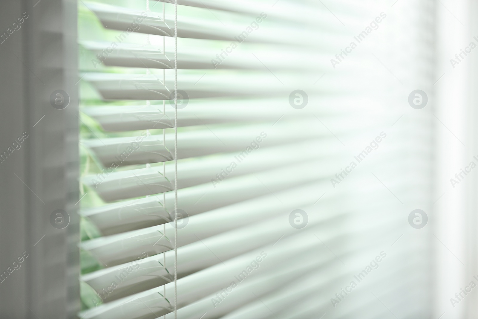 Photo of Closeup view of window with horizontal blinds