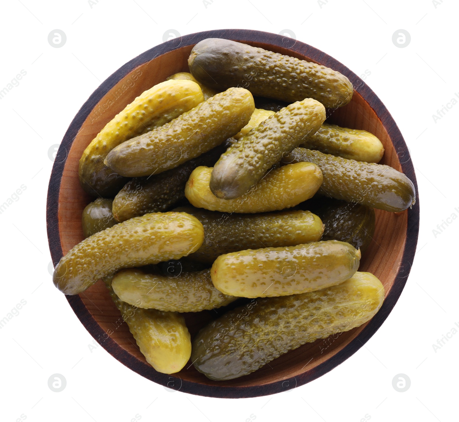 Photo of Bowl of tasty pickled cucumbers isolated on white, top view