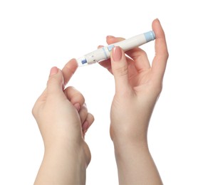 Photo of Diabetes. glucose testing. Woman using lancet pen on white background, closeup