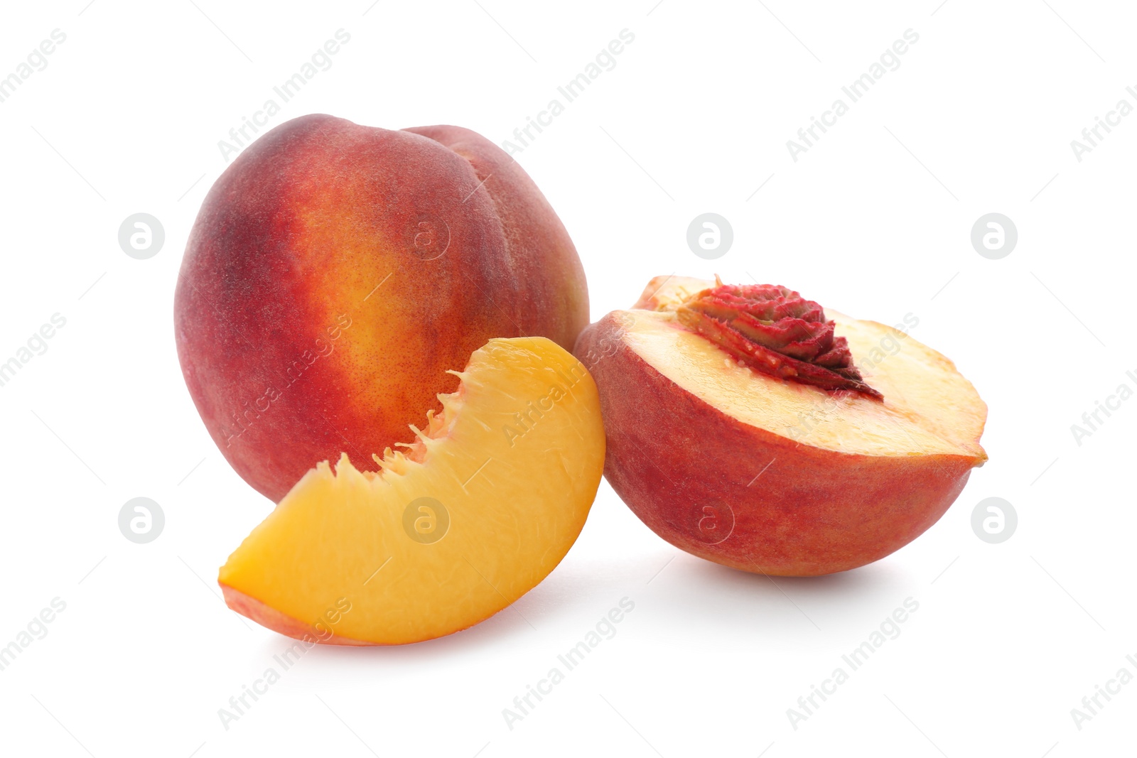 Photo of Whole and cut ripe peaches isolated on white