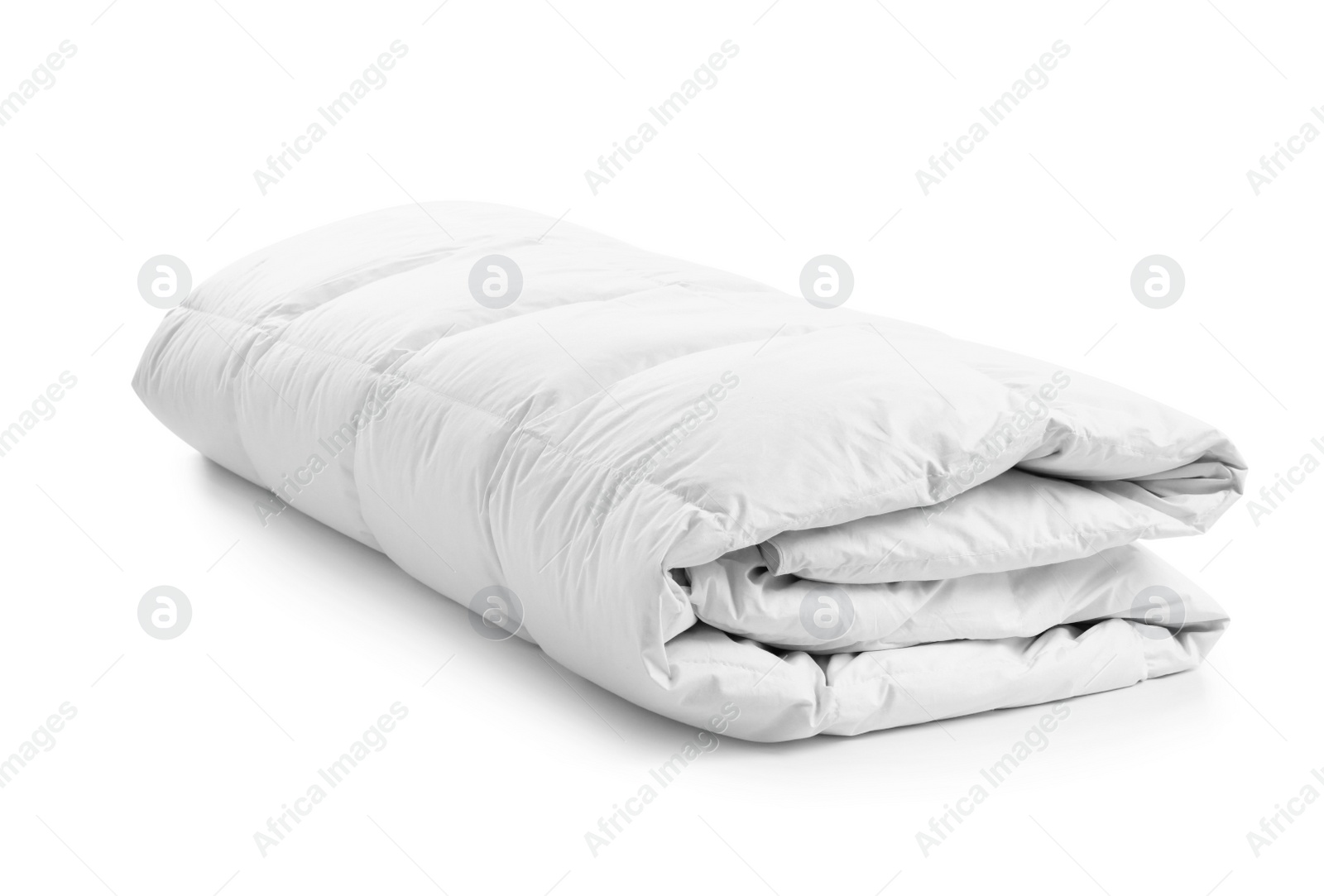 Photo of Folded soft blanket on white background. Textile for bedroom interior