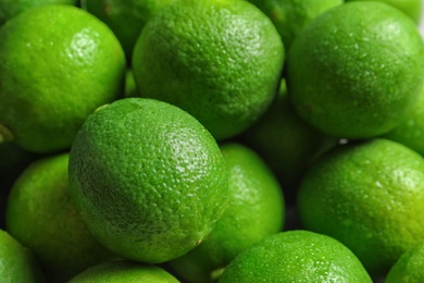 Photo of Fresh ripe green limes as background