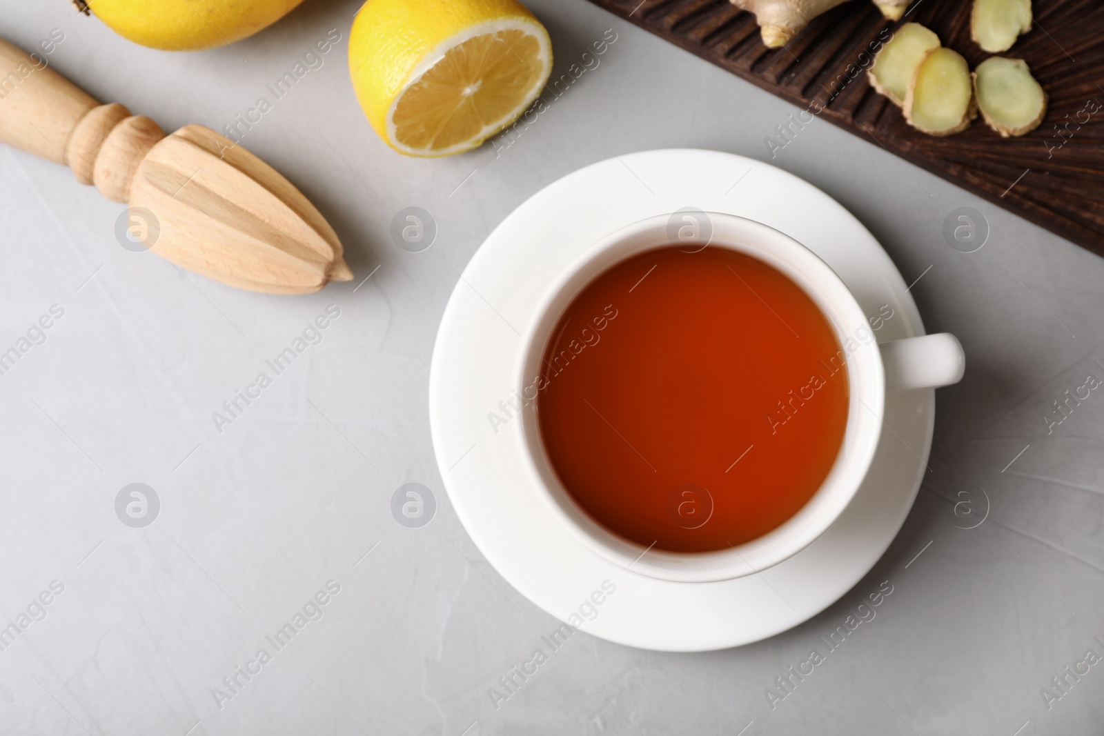 Photo of Flat lay composition with cup of tea and space for text on grey background. Cough remedies