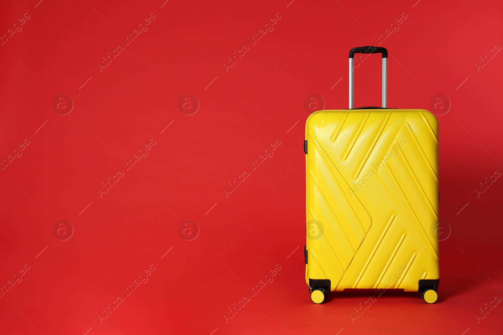 Photo of Stylish suitcase on color background. Space for text