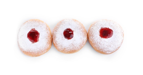 Photo of Hanukkah doughnuts with jelly and sugar powder on white background, top view