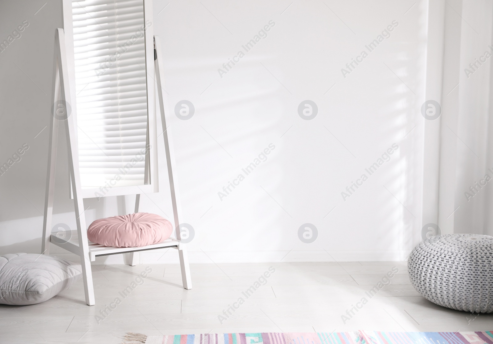 Photo of Large stylish mirror near white wall indoors. Space for text