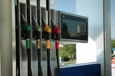 Fuel pistols at modern gas filling station