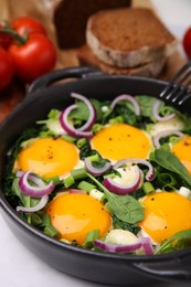 Tasty Shakshouka served on white table, closeup