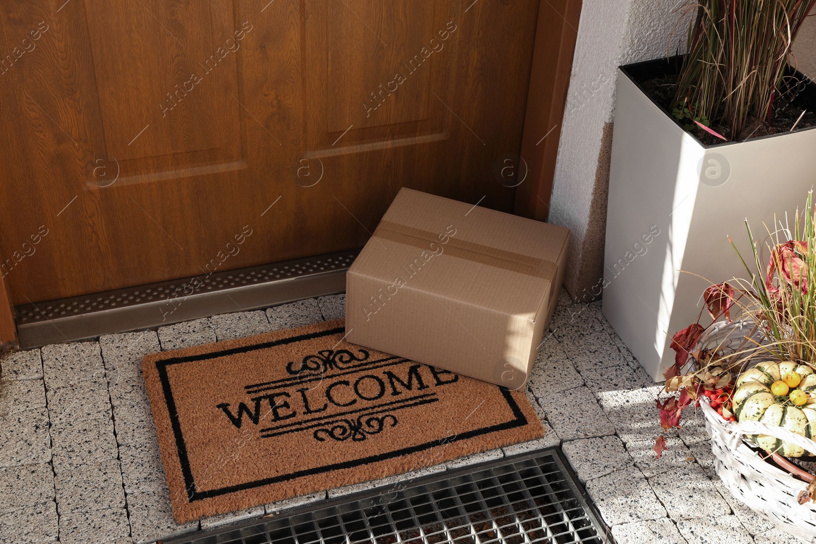 Photo of Parcel delivered on mat near front door