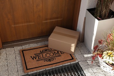 Parcel delivered on mat near front door
