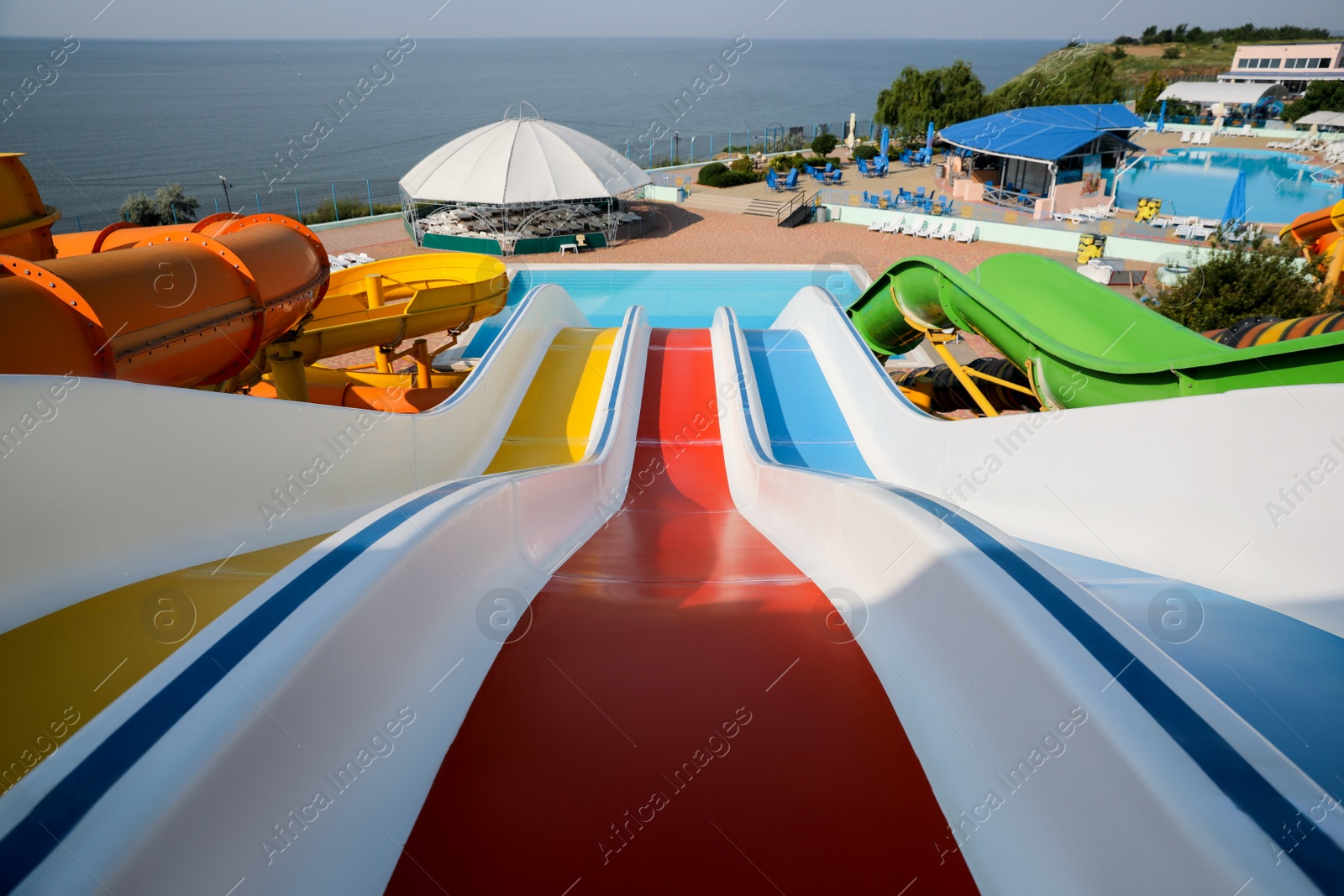 Photo of Colorful slides in water park on sunny day