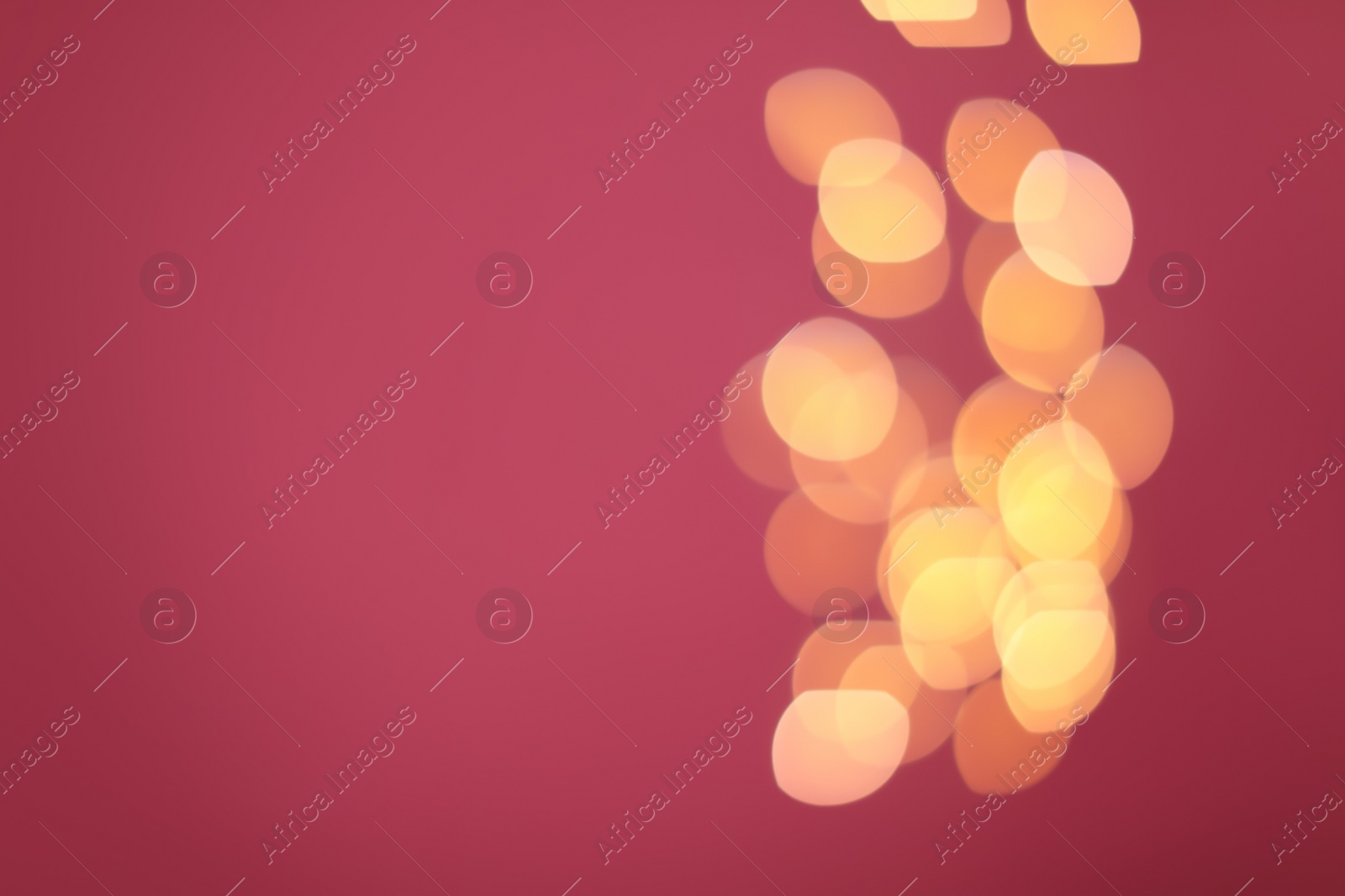 Photo of Blurred view of beautiful lights on pink background, space for text. Bokeh effect