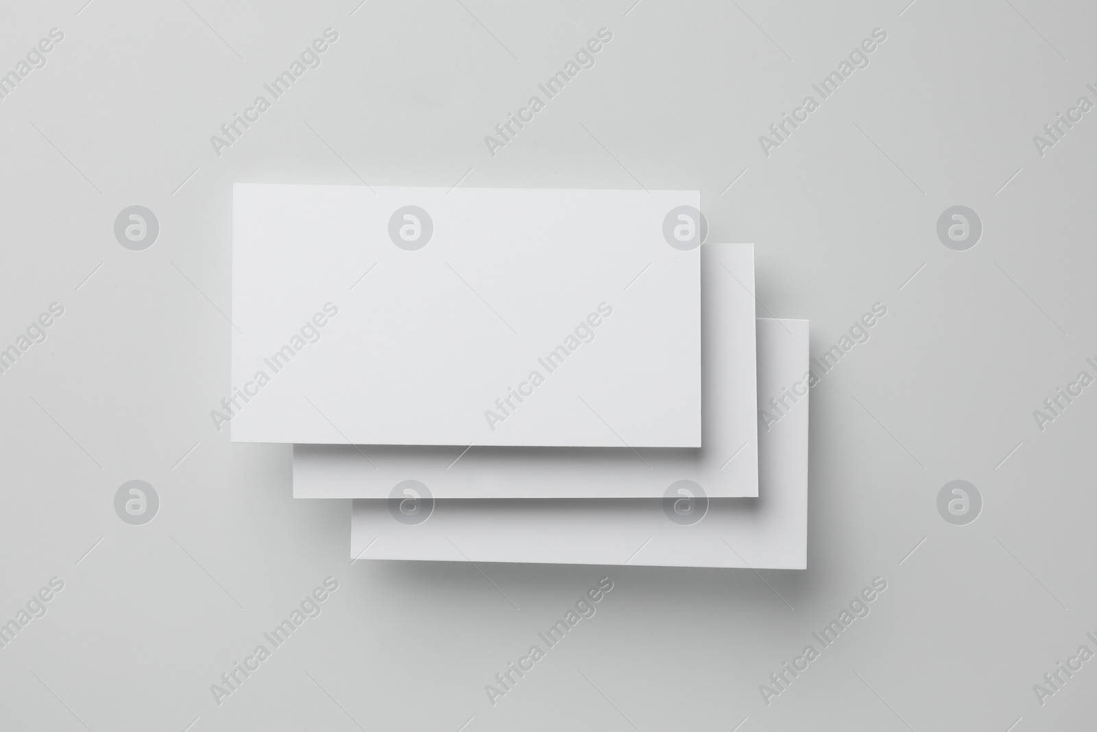 Photo of Blank business cards on white background, top view. Mockup for design