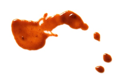 Photo of Drop of barbecue sauce on white background, top view