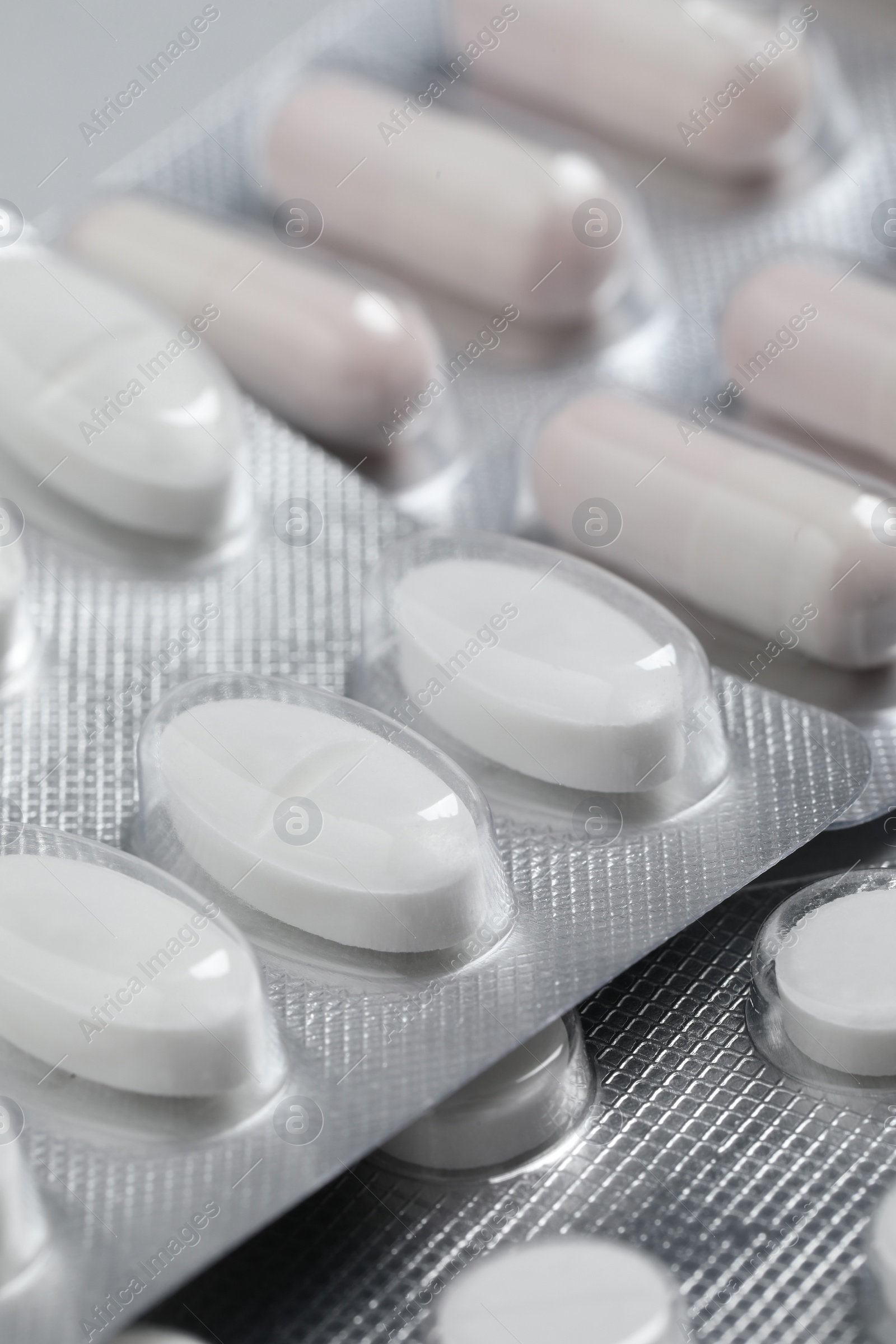 Photo of Pills in blisters as background, closeup view