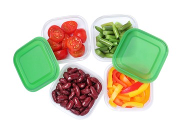 Fresh vegetables in plastic containers on white background, top view