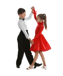 Beautifully dressed couple of kids dancing on white background