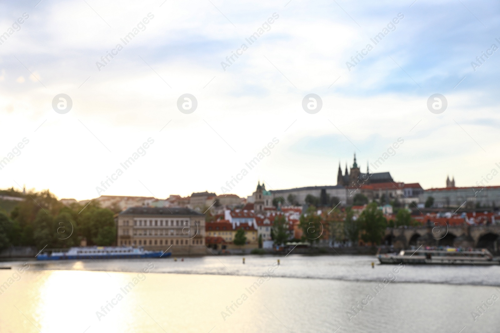 Photo of PRAGUE, CZECH REPUBLIC - APRIL 25, 2019: Blurred cityscape with Vltava river