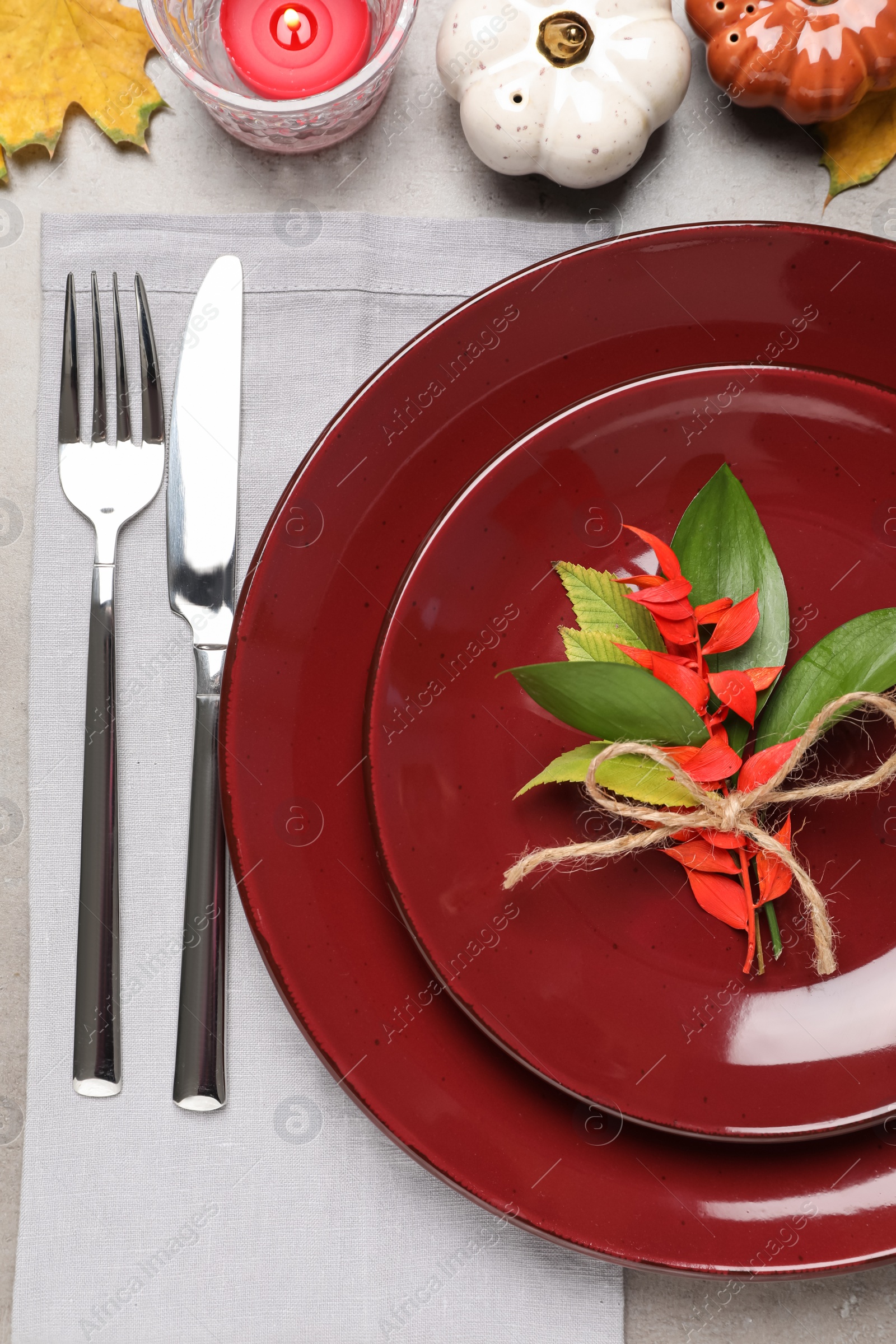 Photo of Beautiful place setting with autumn decor on grey table, flat lay