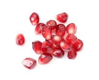 Pile of tasty pomegranate grains isolated on white, top view