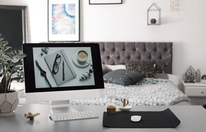 Photo of Stylish workplace interior with modern computer on desk