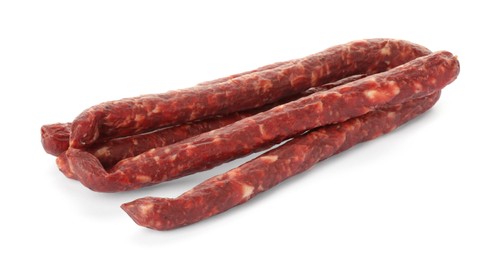 Thin dry smoked sausages isolated on white