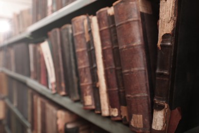 Photo of Blurred view of old books on shelf in library