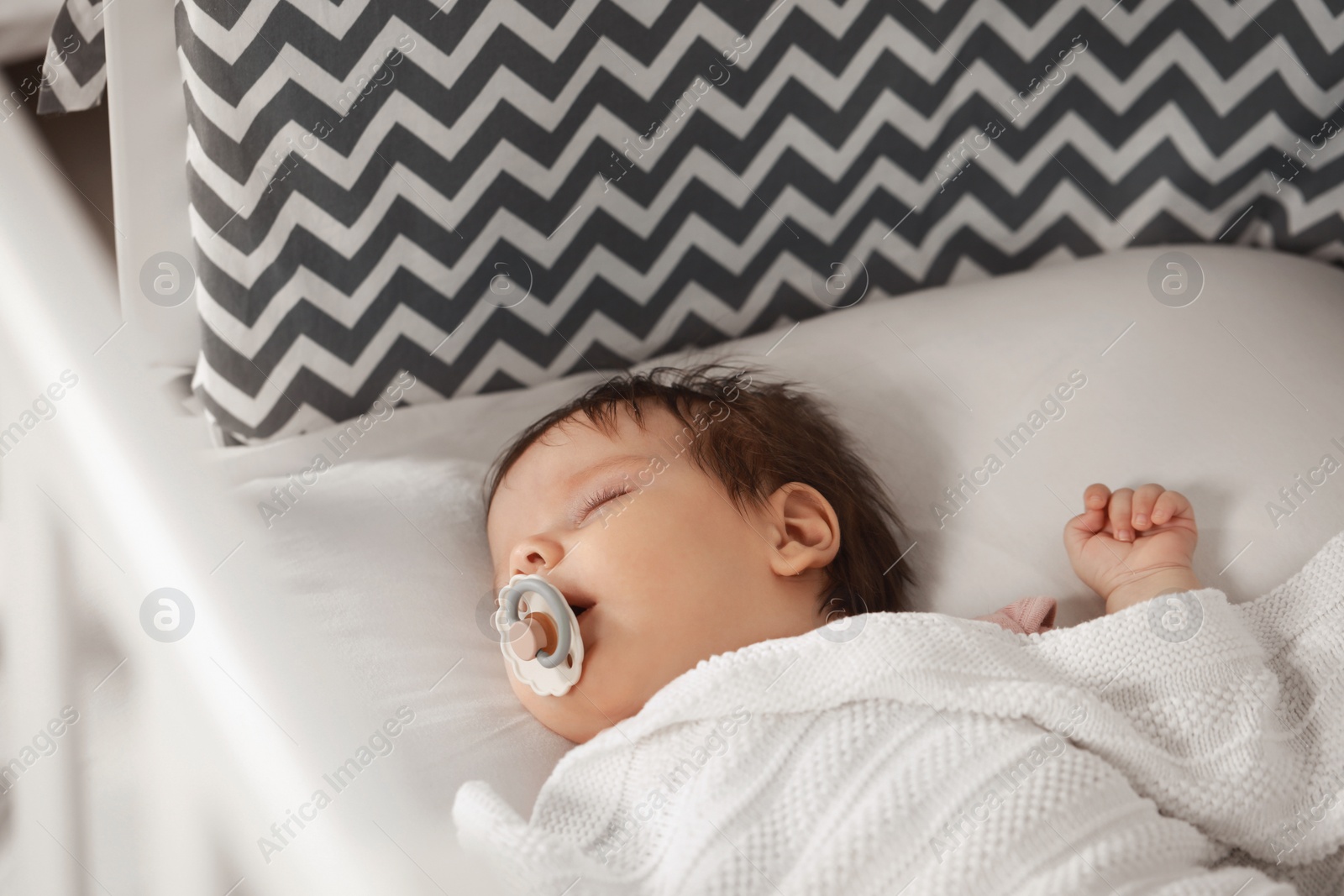 Photo of Cute little baby sleeping on cosy crib