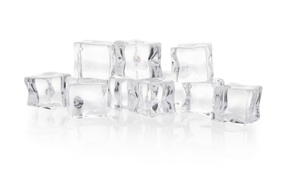 Photo of Many melting crystal clear ice cubes isolated on white