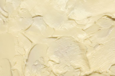 Photo of Texture of fresh natural butter as background, top view