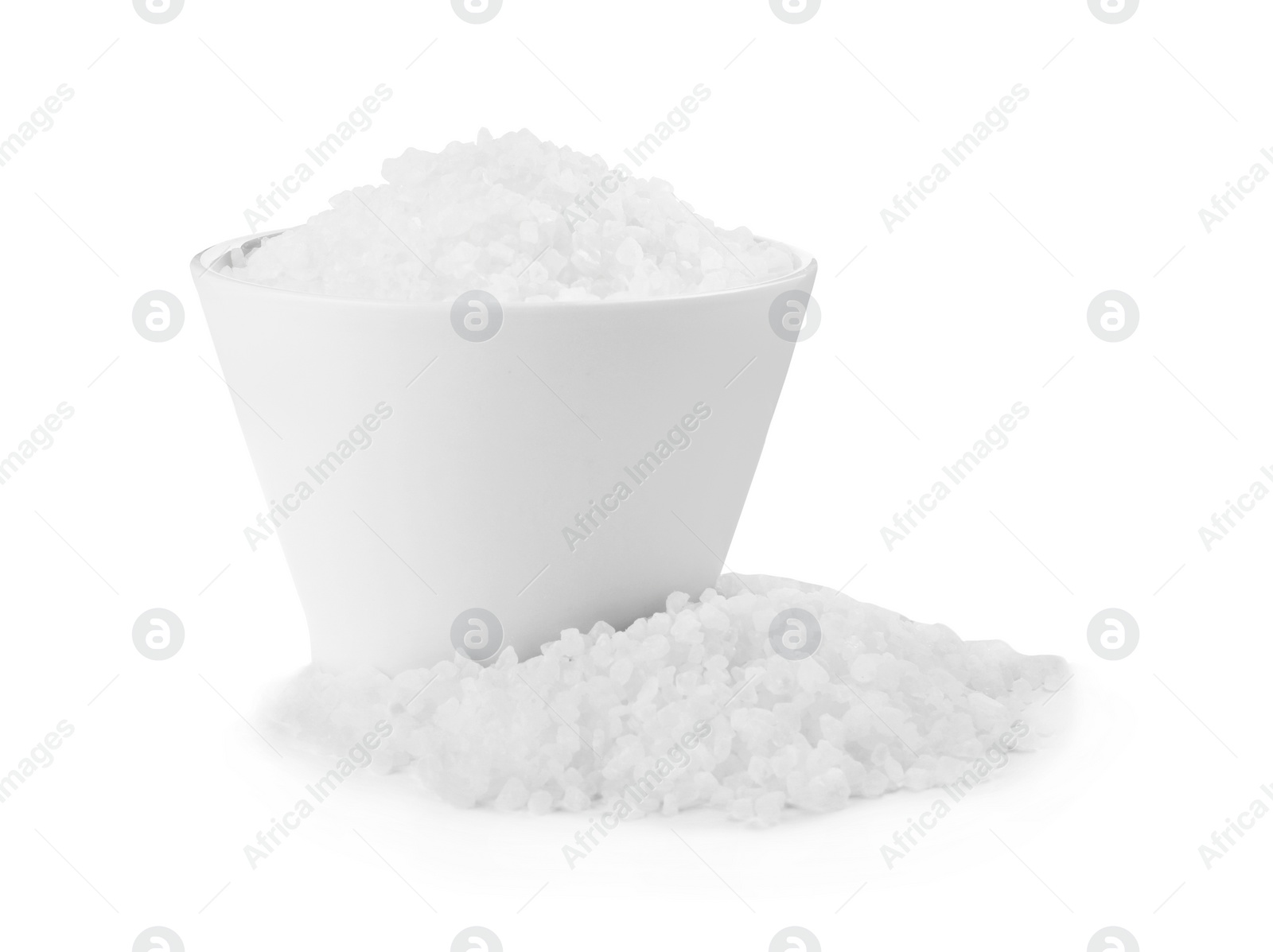 Photo of Ceramic bowl with natural sea salt isolated on white