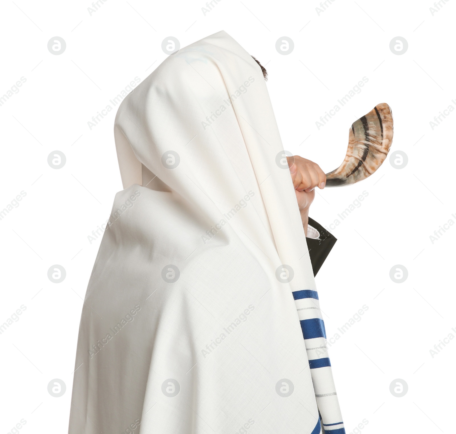 Photo of Jewish man in tallit blowing shofar on white background. Rosh Hashanah celebration