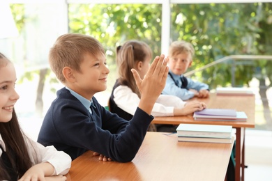 Little children in classroom. Stylish school uniform