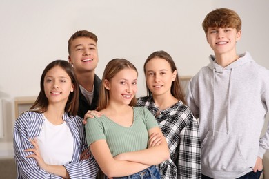 Group of happy teenagers together at home
