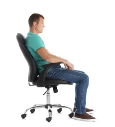 Man sitting in office chair on white background. Posture concept